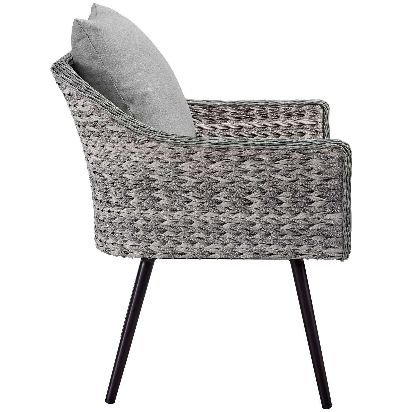 Gray woven rattan outdoor loveseat and armchairs with light gray cushions and black angled metal legs.
