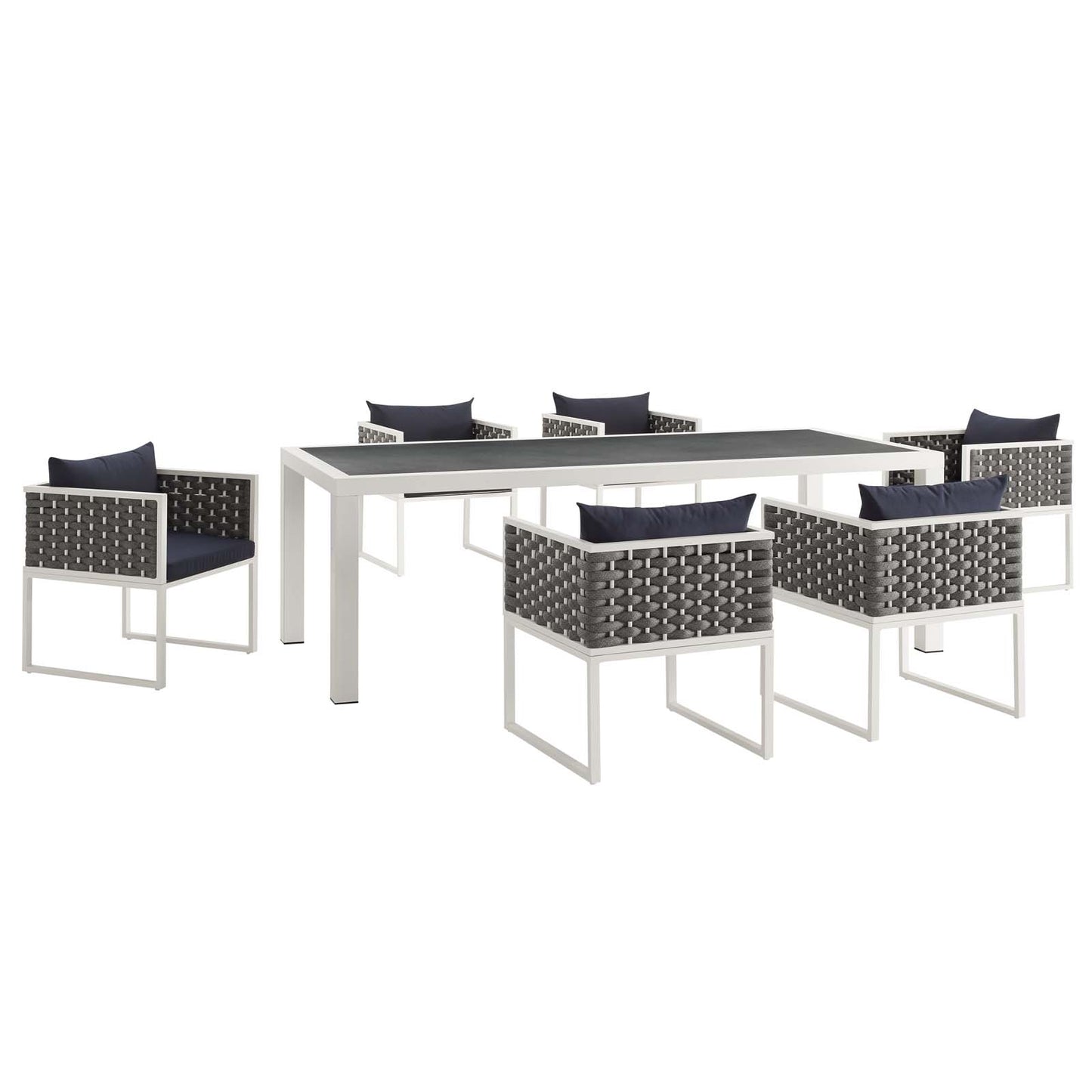 White rectangular outdoor aluminum dining table with a dark top, surrounded by gray aluminum dining chairs with navy cushions.