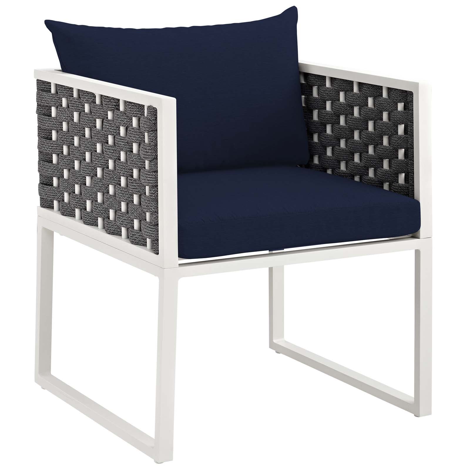 White aluminum-frame outdoor dining set with navy cushions and gray woven side panels.
