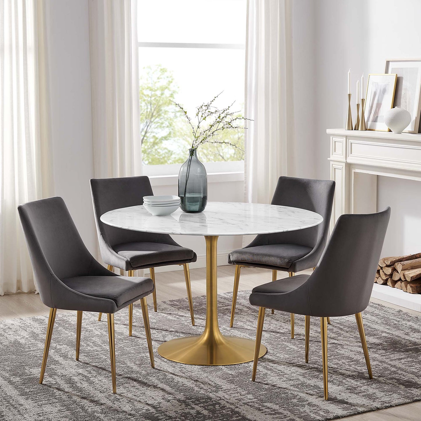 Round faux-marble dining table with a brass pedestal; modern white table.