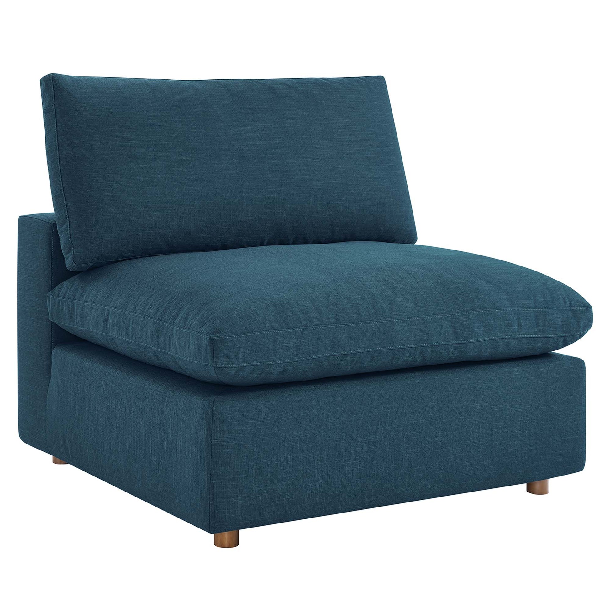 Teal blue fabric upholstered armless chair with thick seat and back cushions, boxy frame and short wooden legs.