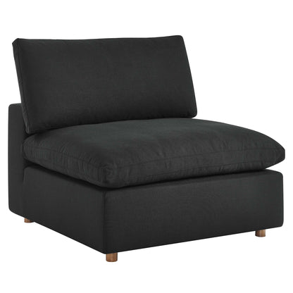 Black fabric armless accent chair with a thick cushioned seat and back cushion on short wooden legs.