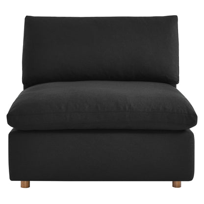 Modern black fabric armless chair with down-filled, overstuffed cushions and short wood legs.