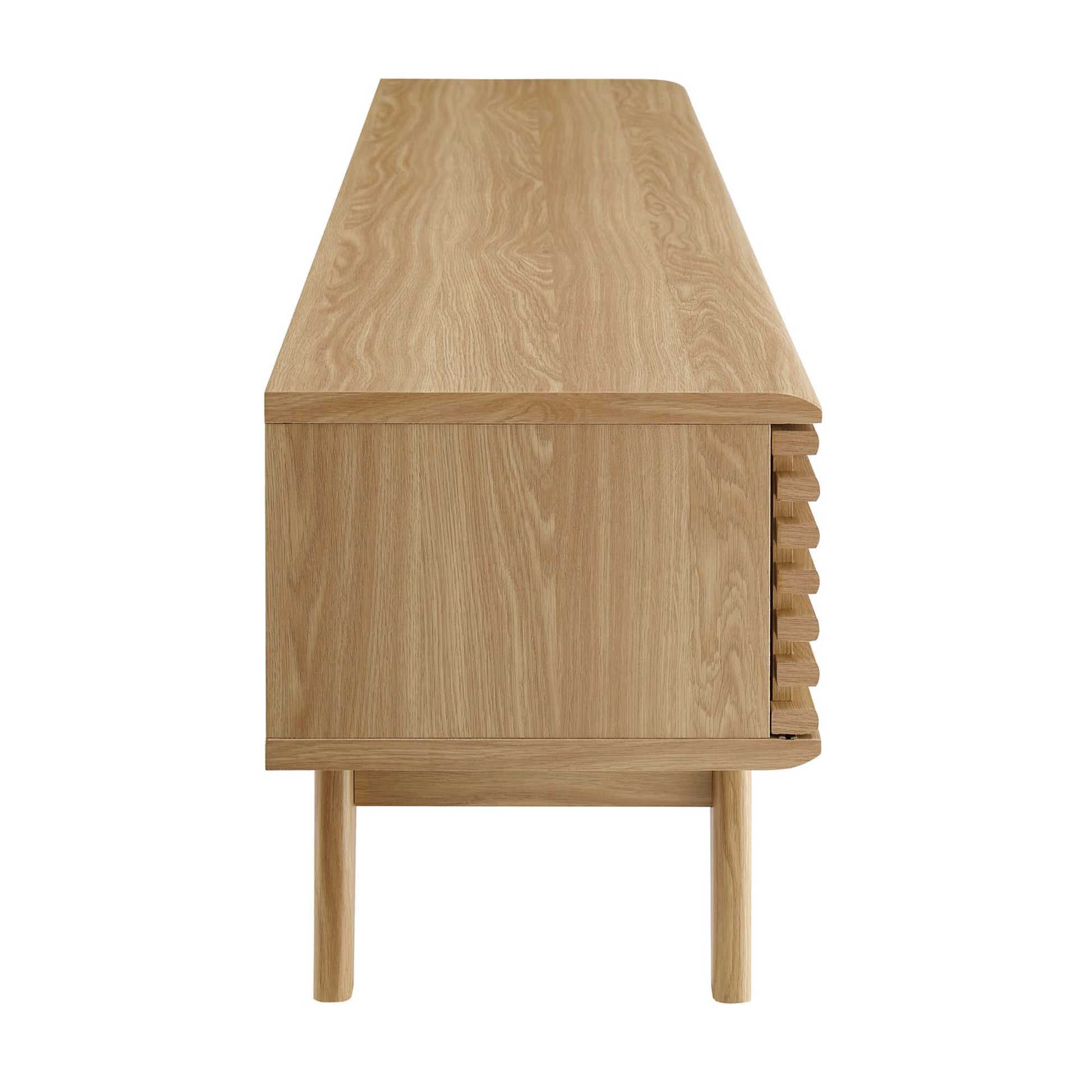 Natural oak TV stand / entertainment center with smooth top, flush front, right-side slatted panel; raised tapered legs, mid-century style.