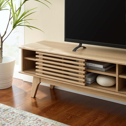 Light oak wood TV stand with slatted central cabinet and open shelves, mid-century modern.