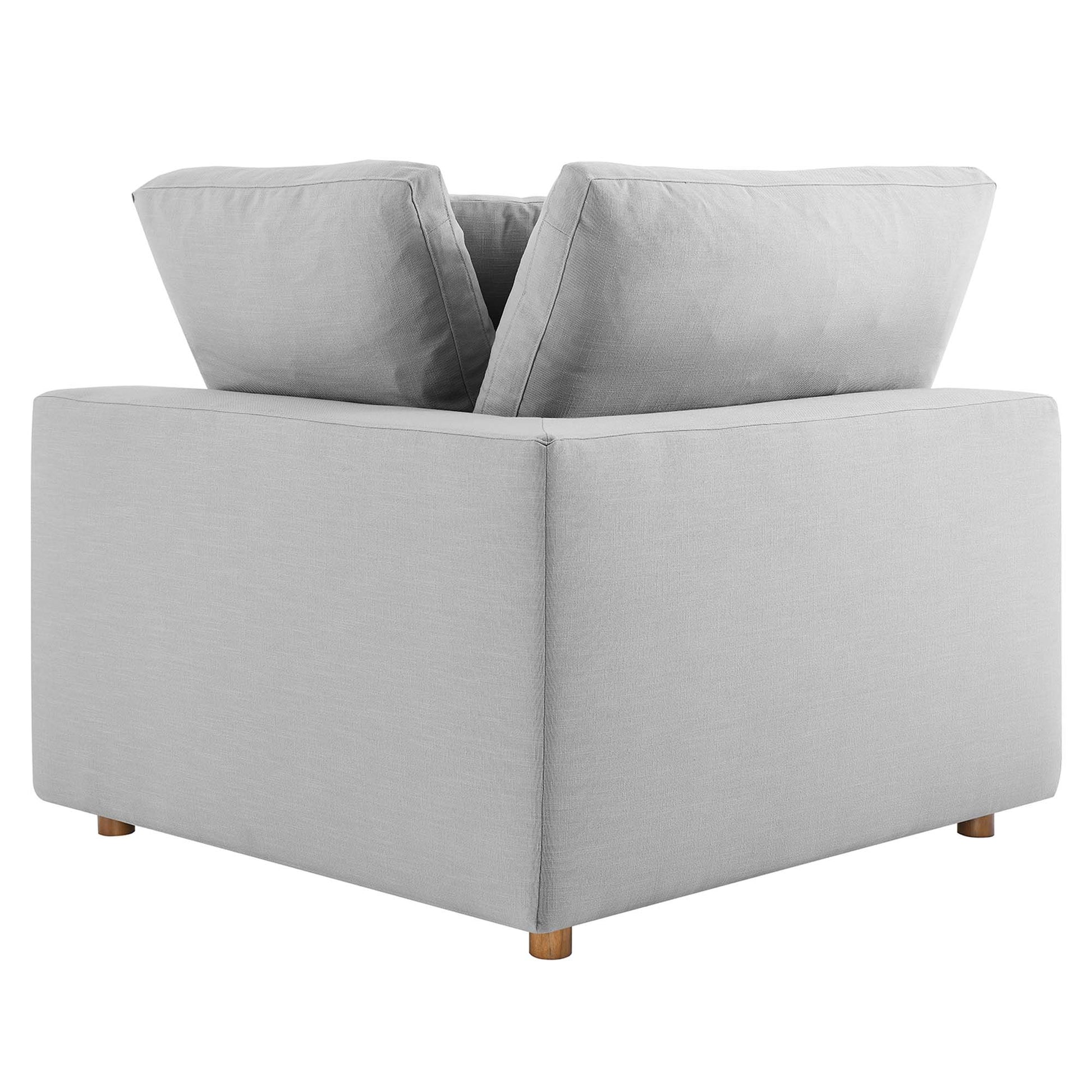 Light gray fabric square-arm corner chair with two back cushions & short wooden legs.