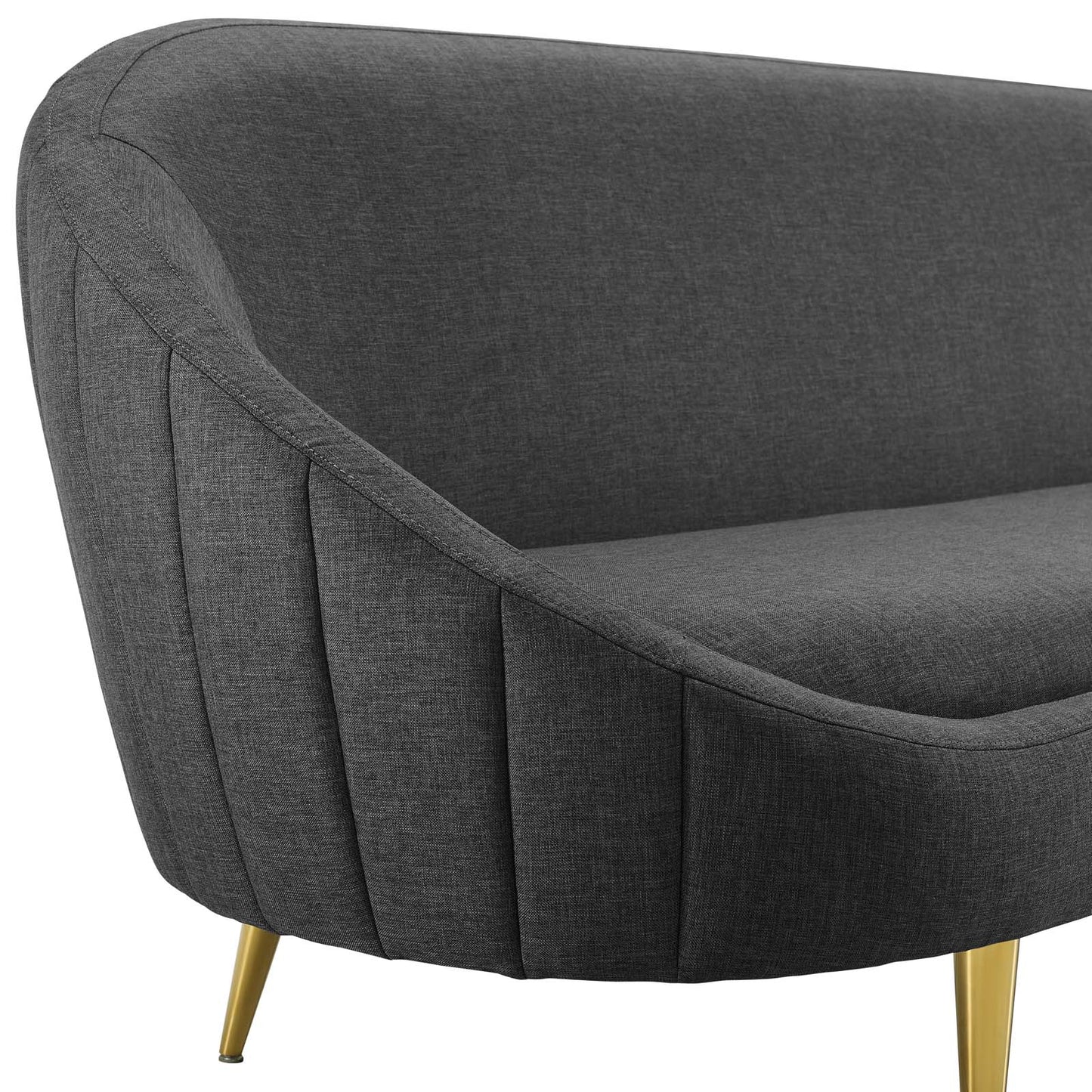 Dark gray mid-century fabric sofa with vertical curved back and channel tufting.