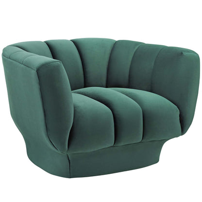 Emerald green velvet vertical channel tufted armchair with plush cushions and rounded arms.