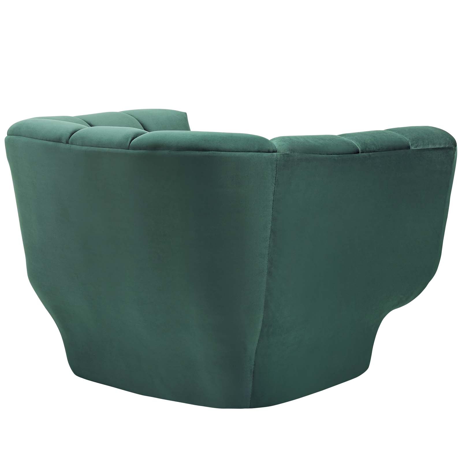 Green velvet armchair with vertical-channel tufting and a rounded silhouette.