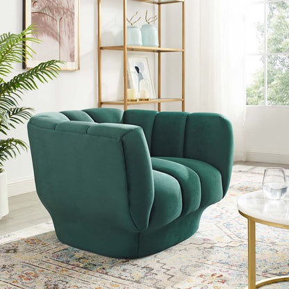 Teal green velvet armchair with vertical channel tufting, chunky curved arms, mid-century modern living room seating.
