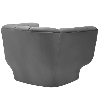 Grey fabric barrel chair with curved back and tufted cushions, modern cozy living room seating.
