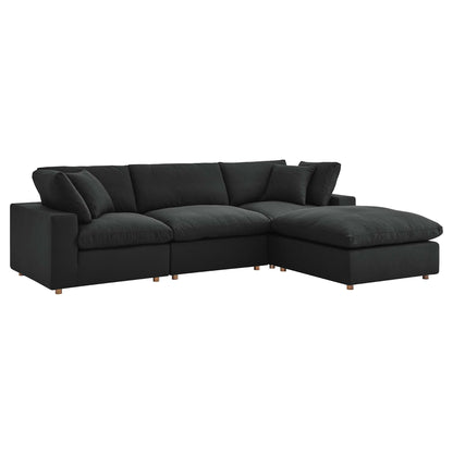 Dark charcoal fabric sectional sofa with chaise, plush cushions and wooden legs in a modern L-shape.