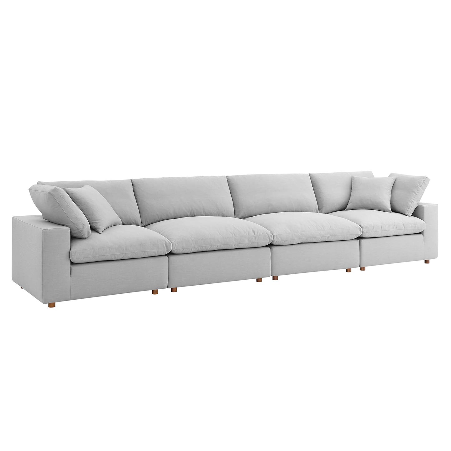 Light gray fabric modular sectional sofa with plush back and seat cushions and wooden legs.