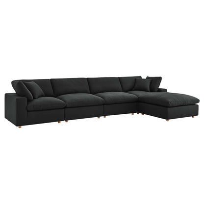 Charcoal fabric sectional sofa with right-side chaise, plush cushions, and light wood legs.