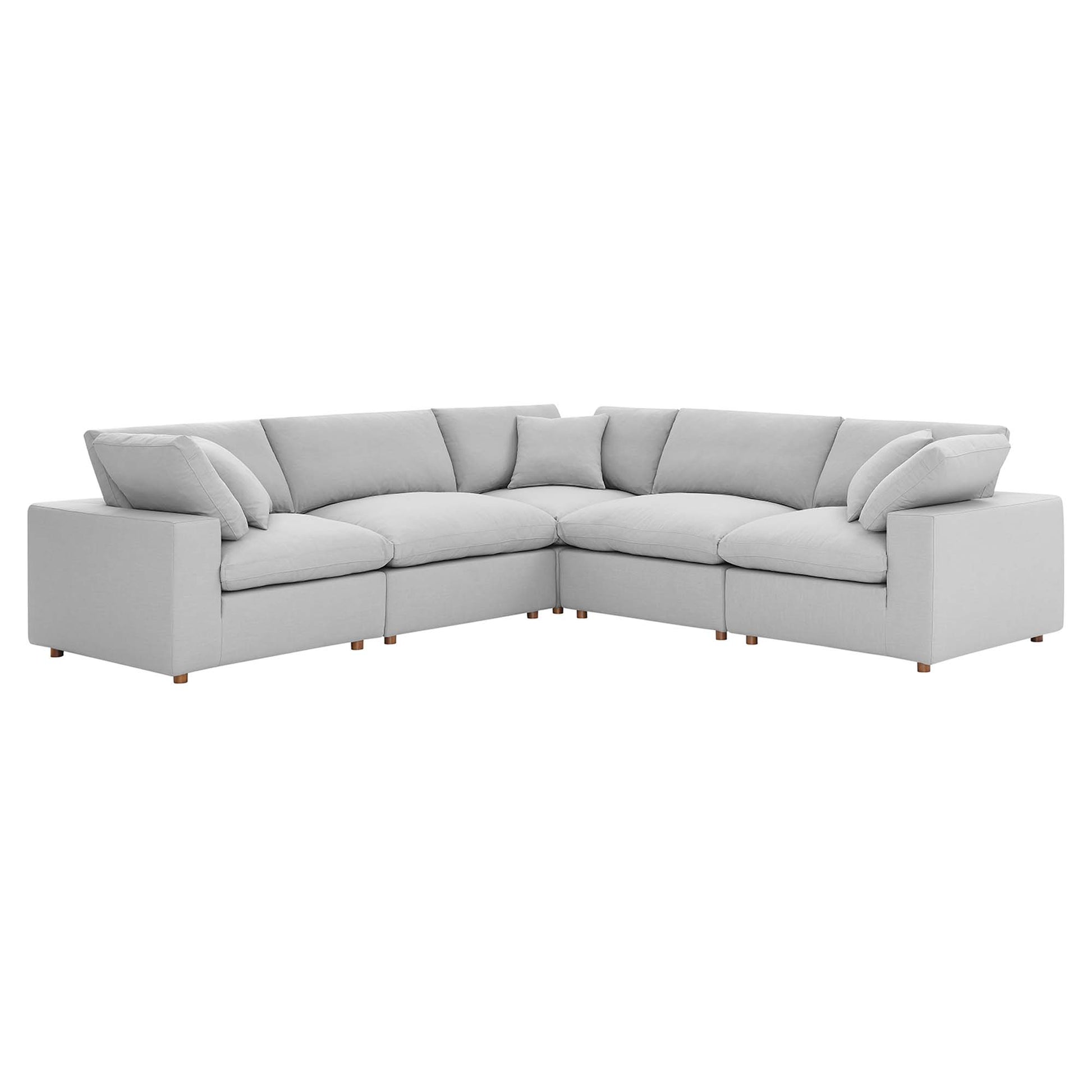 Light gray fabric L-shaped sectional sofa with plush cushions and short wooden legs.