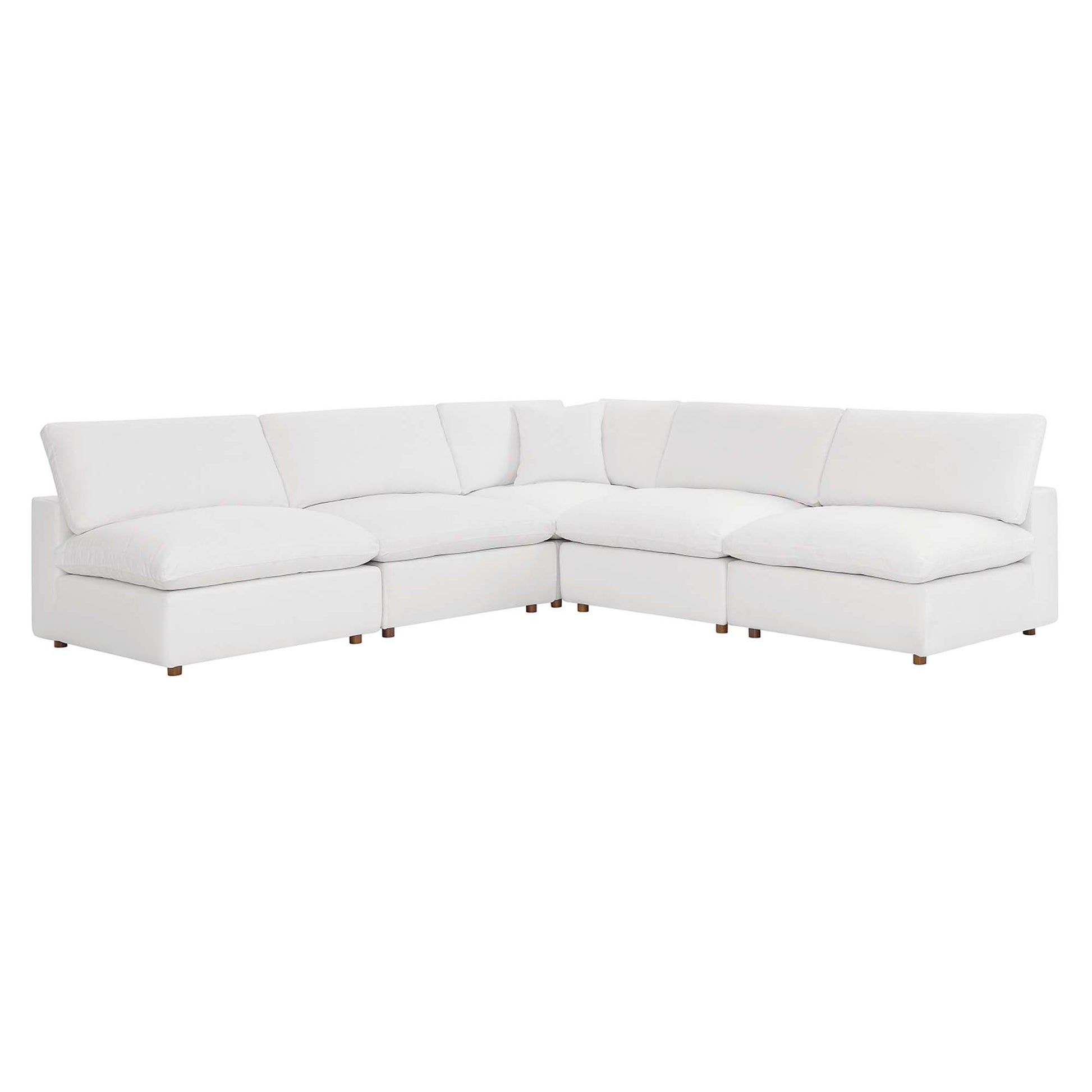 White fabric sectional sofa in an L-shape with plush cushions and light wood legs.