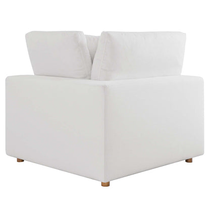 White fabric armless sectional sofa, 5-piece modular set with cushions, contemporary lounge seating.
