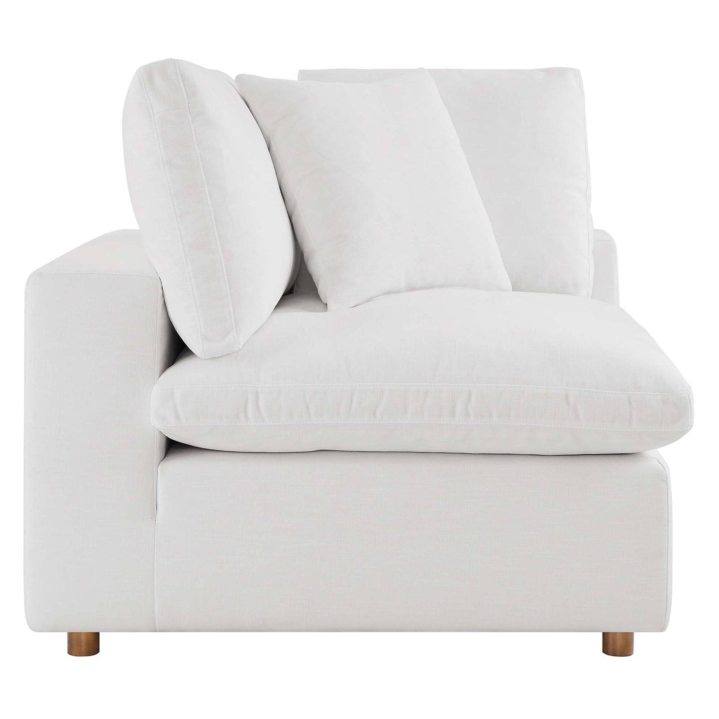 Off-white fabric armless sectional sofa with overstuffed cushions.