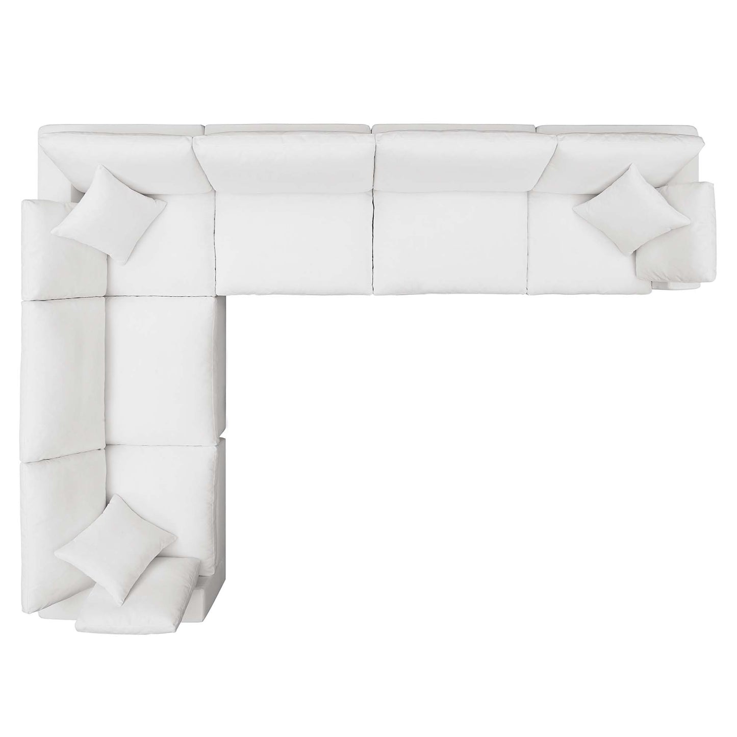 White fabric sectional sofa in an L-shape with matching cushions and a chaise on the left.