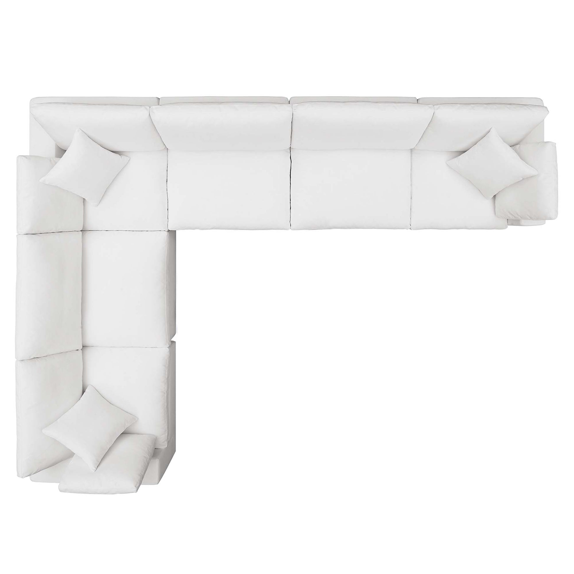 White fabric sectional sofa in an L-shape with matching cushions and a chaise on the left.