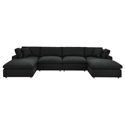 Charcoal black modular sectional sofa with plush cushions, low back, fabric upholstery and wooden legs; chaise on both ends.