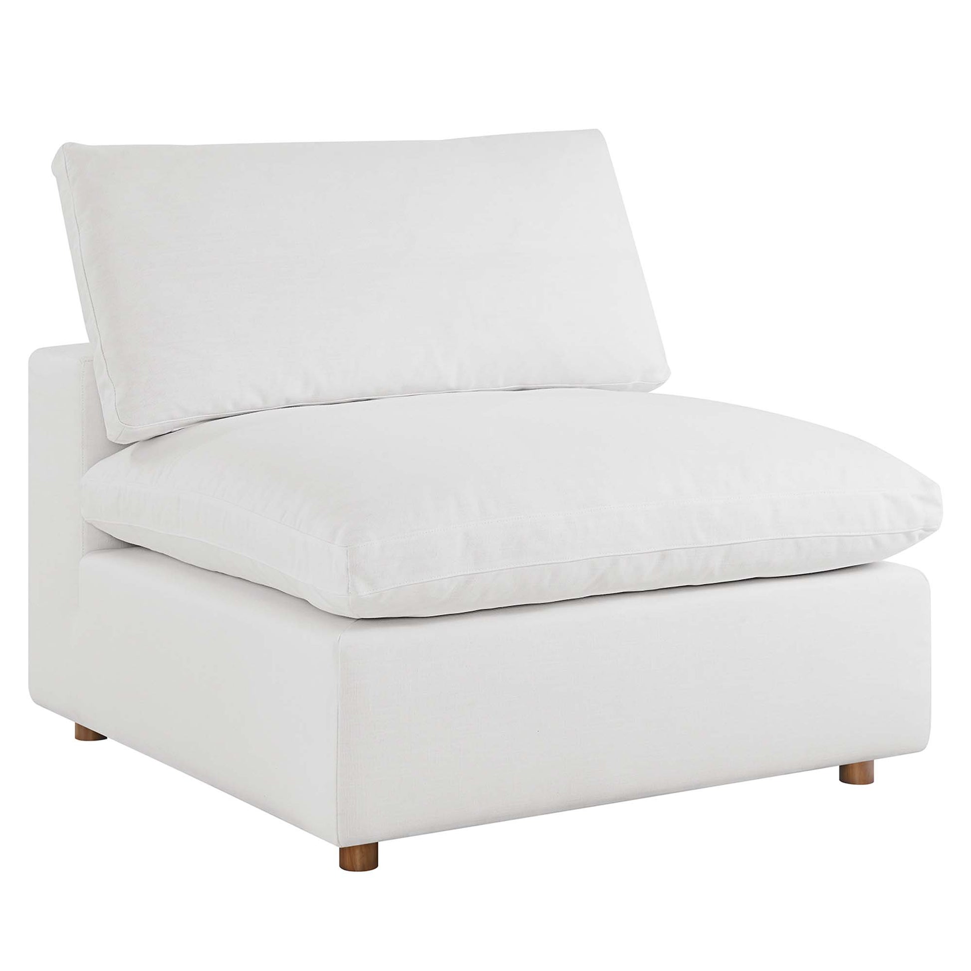 White fabric modular sectional sofa with armless seating sections and thick seat and back cushions on a low block base with small wooden legs.