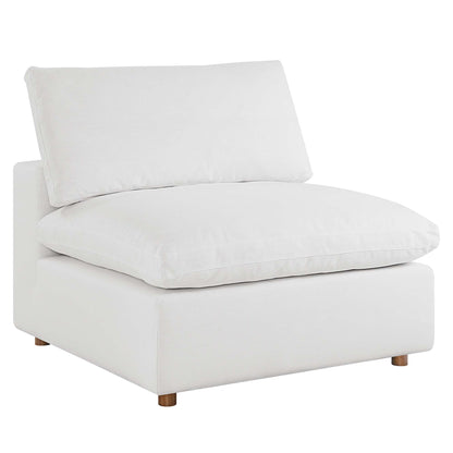 White fabric modular sectional sofa with armless seating sections and thick seat and back cushions on a low block base with small wooden legs.