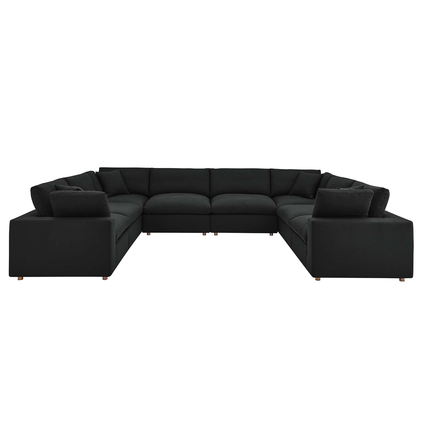 Large black fabric sectional sofa, L-shaped with thick cushions and wooden legs; modern modular living room seating.