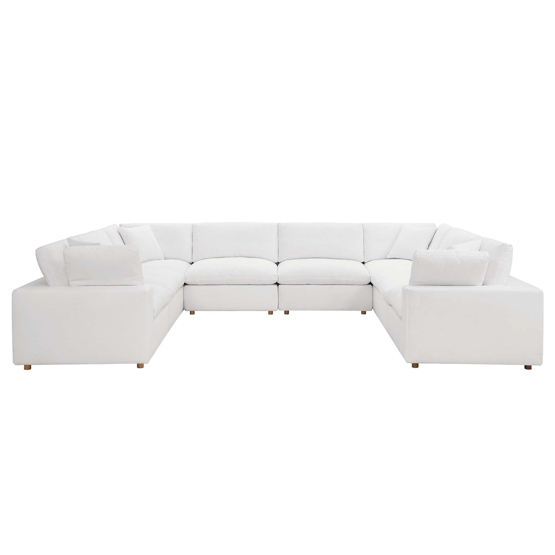 White fabric modular L-shaped sectional sofa with plush cushions and short wooden legs.