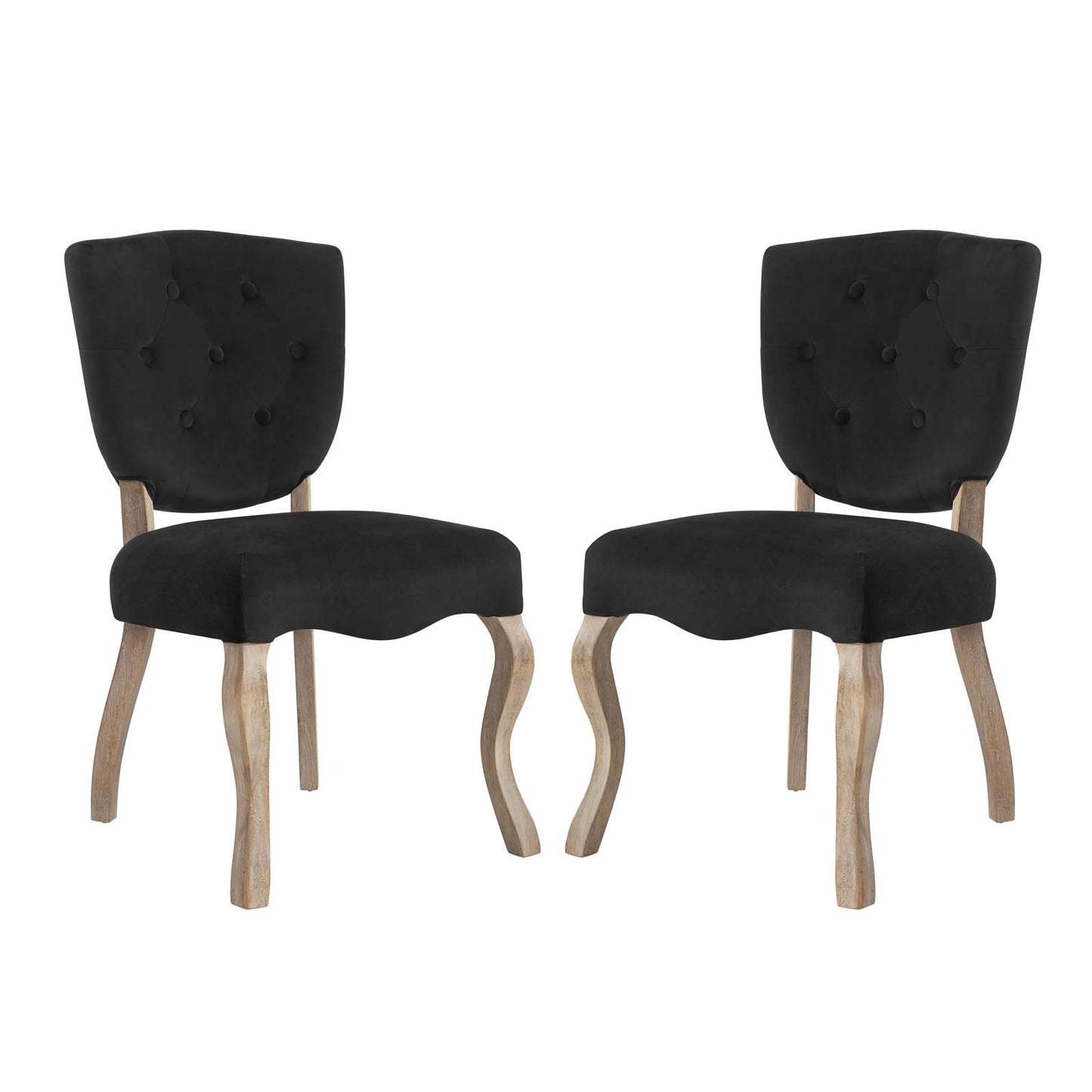 Pair of black button-tufted dining chairs with curved natural wood legs.