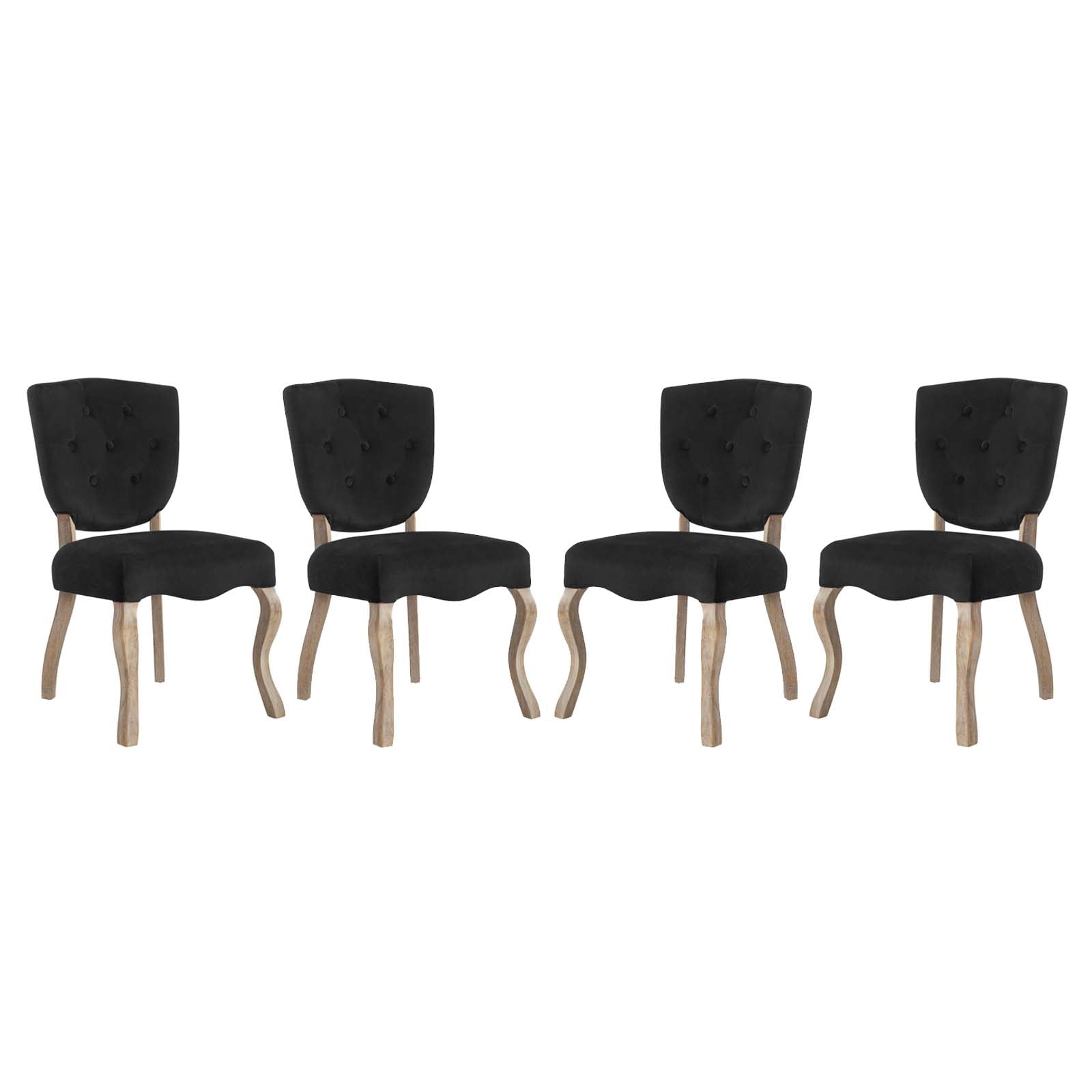 Set of four black tufted dining chairs with light wood curved legs and cushioned seats.