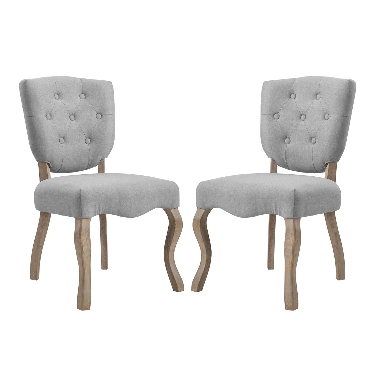 Pair of gray fabric-upholstered dining chairs with tufted backs and curved natural-wood legs.