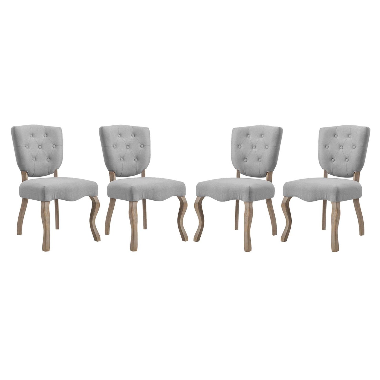 Set of four gray tufted fabric dining chairs with curved natural wood legs and button-back upholstery.