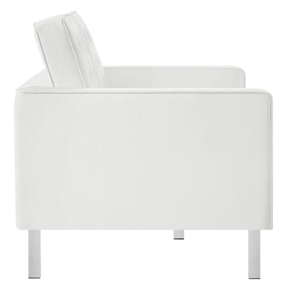White tufted vegan leather loveseat with rectangular cushions, clean lines, and metal legs; modern minimalist seating.