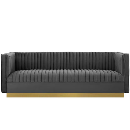 Grey performance velvet sofa with vertical channel tufting and low arms.