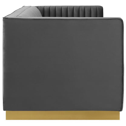 Gray upholstered modular sofa with vertical channel-tufted back, squared arms, and light wood base.