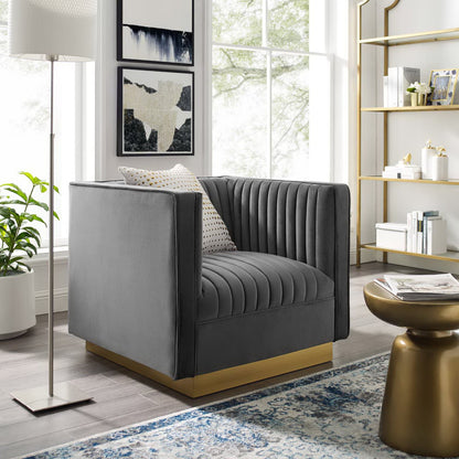Grey velvet vertical channel-tufted armchair in a bright modern living room.