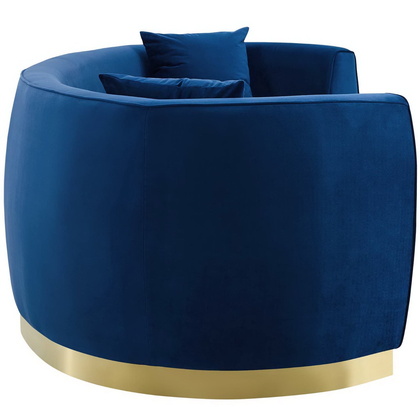Navy blue curved velvet sofa with a gold metal base and cushions