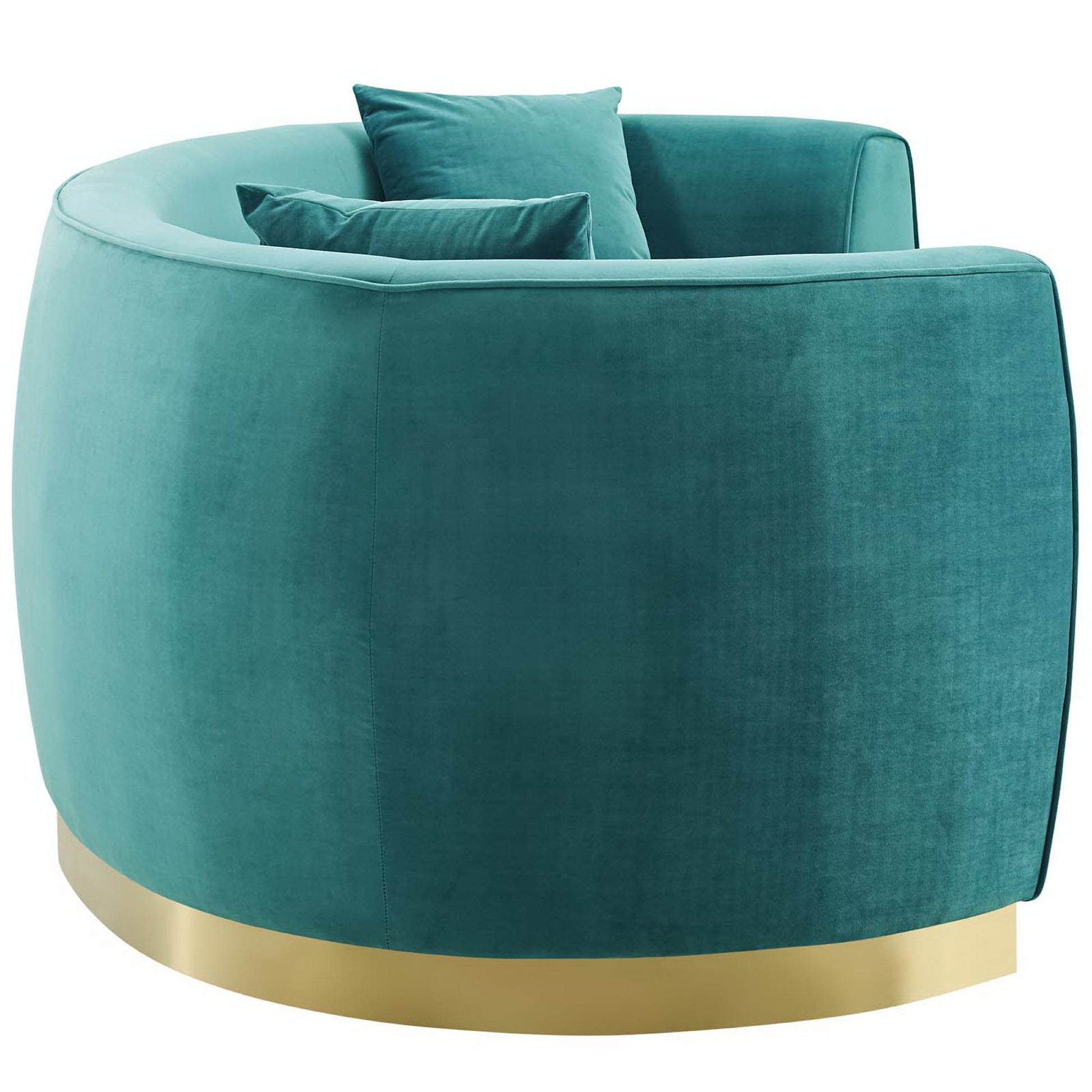 Blue curved velvet sofa with a gold metal base and matching cushions.