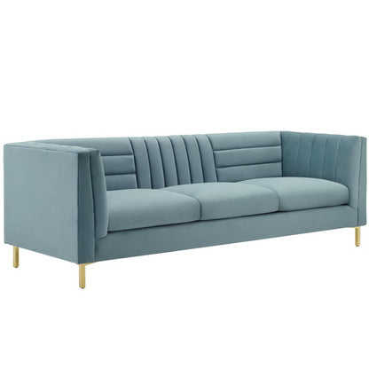 Blue velvet 3-seat sofa with channel-tufted back and arms, gold metal legs, mid-century modern style.