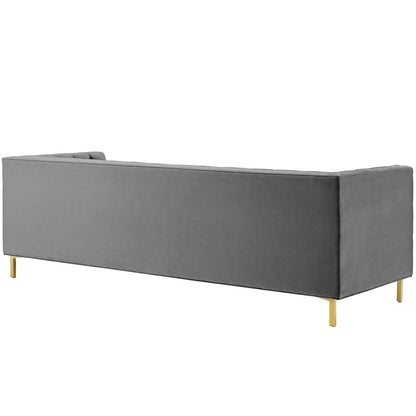 Gray velvet sofa with low back, clean lines, and gold metal legs for modern lounge seating.