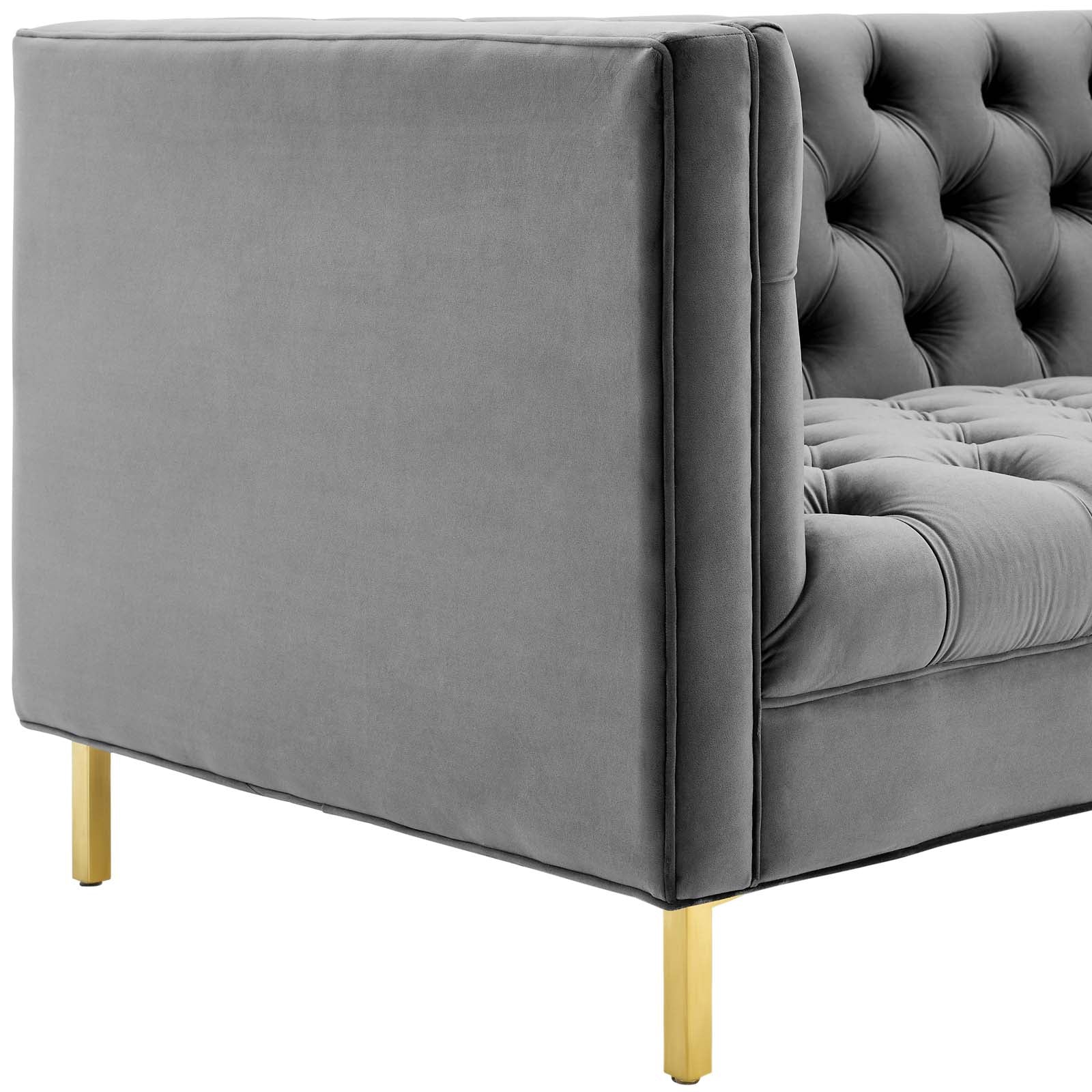 Grey velvet sofa with tufted back & seat, square arms, & gold legs.