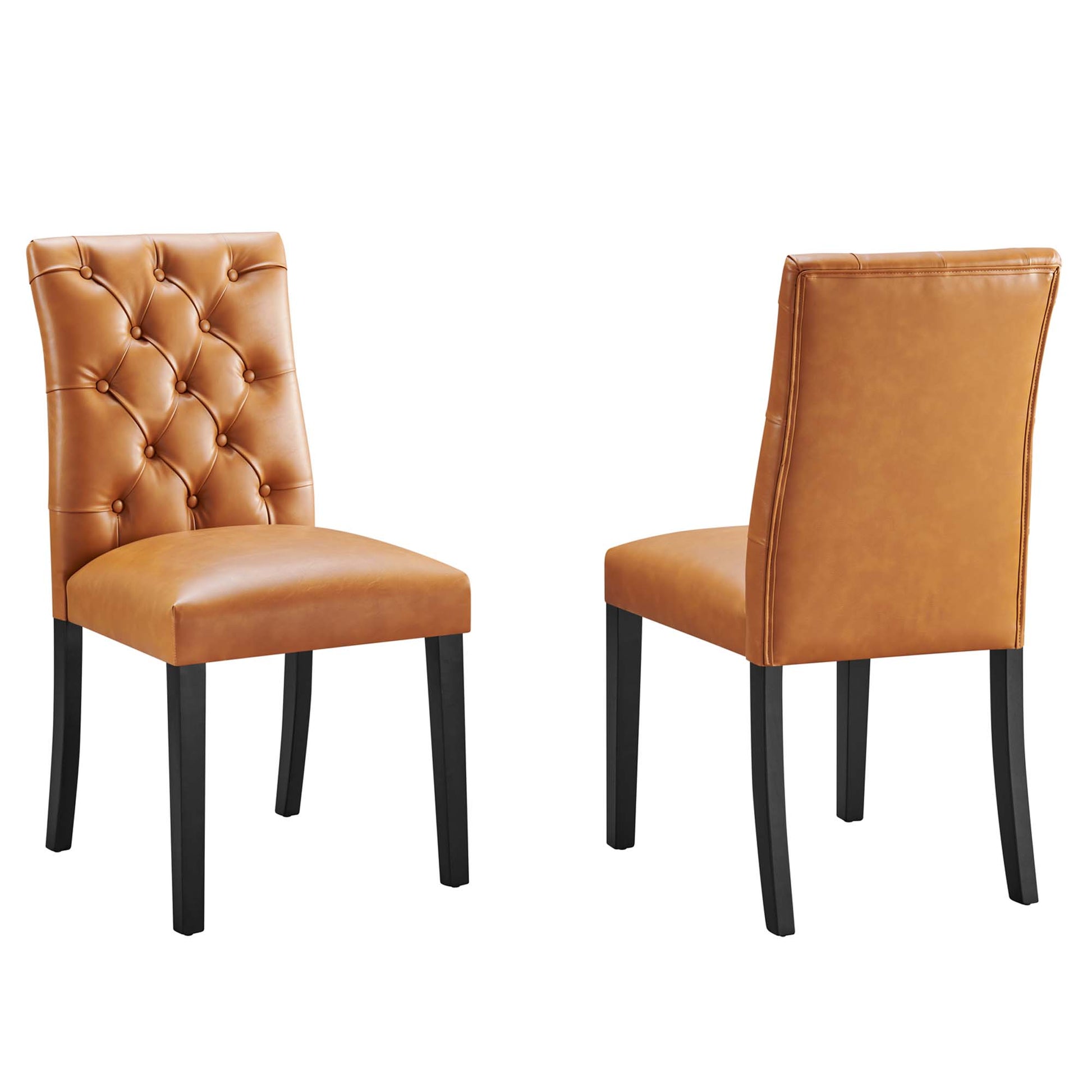 Two tan vinyl dining chairs; left chair with a tufted diamond back, right chair with a plain back, dark wood legs.