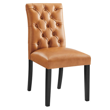 Tan vinyl dining chair with a tufted backrest and dark wood legs.