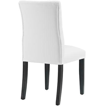White vinyl dining chair with curved high back, padded seat and dark wood legs