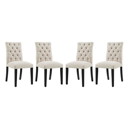 Set of four brown tufted fabric dining chairs with dark wooden legs.