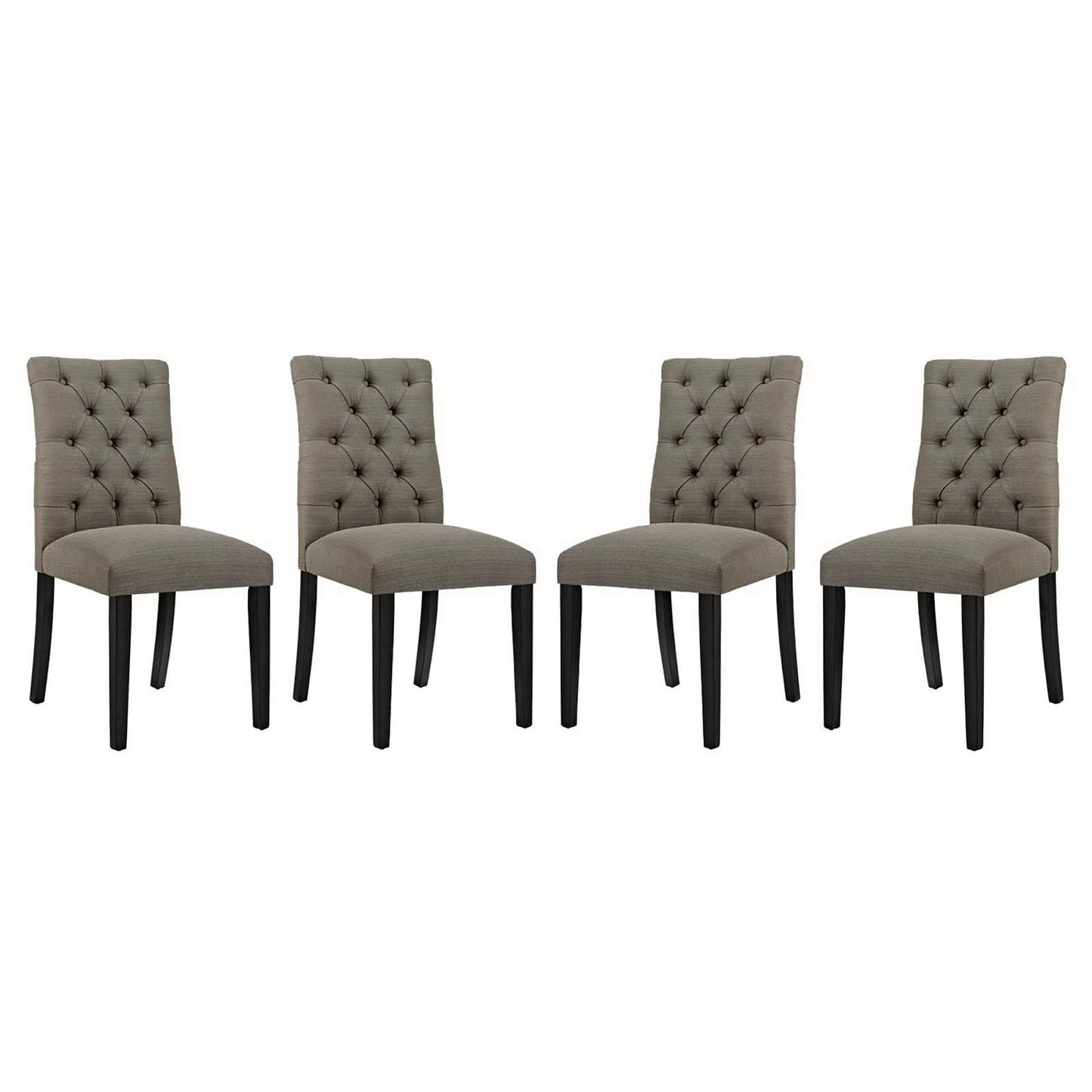 Four taupe tufted dining chairs with dark wooden legs and upholstered seats.