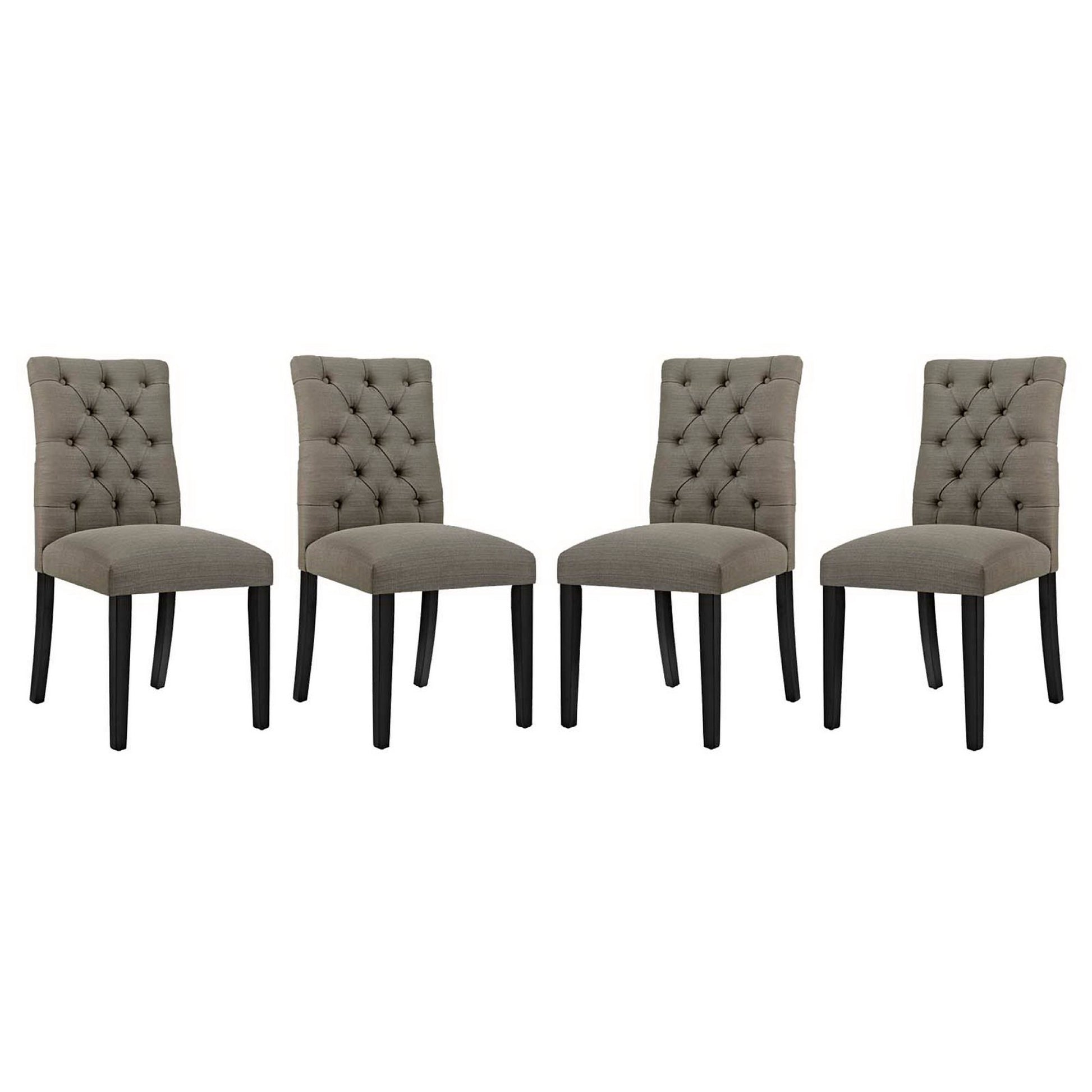 Four taupe tufted dining chairs with dark wooden legs and upholstered seats.