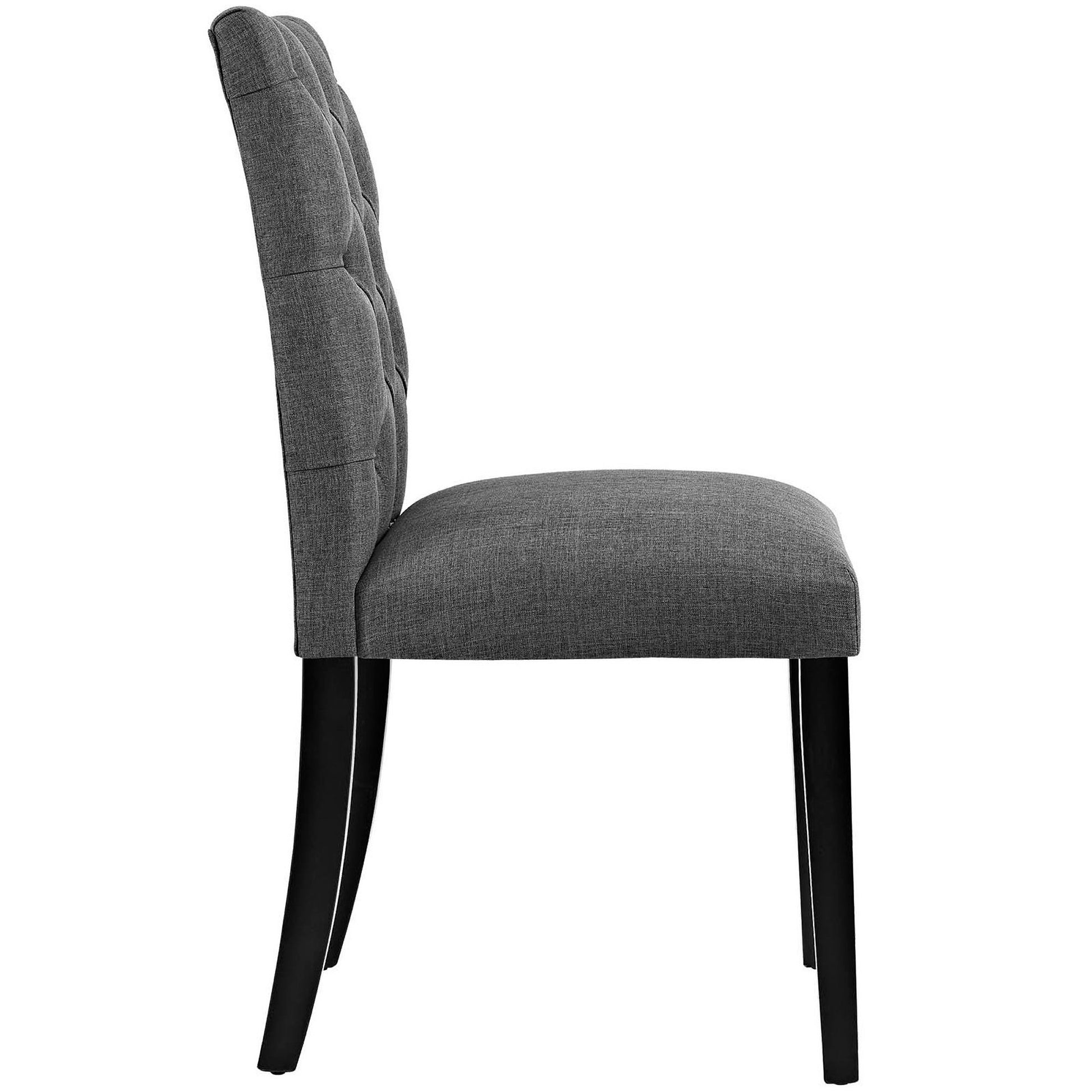 Grey fabric dining chair with tufted back, black wood legs, side profile.