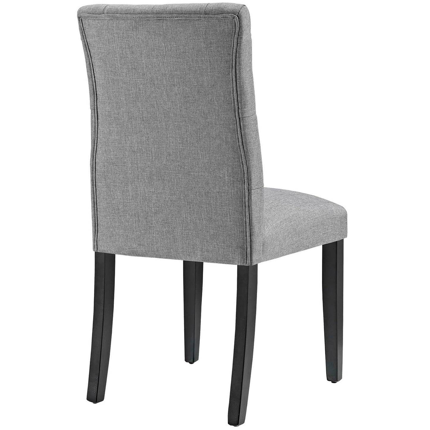 Grey fabric upholstered dining chair with curved padded back and dark wood legs.